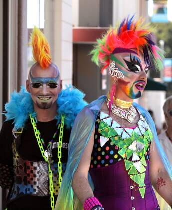 October 8, 2016 - Oceanside, California, USA - 10 8 2016 Oceanside, CA_EARTH INTRUDER, left, and GLAM GLITZ, at right, make their way down Pier View Way in downtown Oceanside, California at the annual North County Pride at the Beach festival. The event was sponsored by the North County LGBTQ Resource Center. They were the event s MC s._ Photo by Oceanside USA - ZUMAn47_