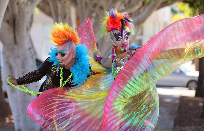 October 8, 2016 - Oceanside, California, USA - 10 8 2016 Oceanside, CA_EARTH INTRUDER, left, and GLAM GLITZ, at right, make their way down Pier View Way in downtown Oceanside, California at the annual North County Pride at the Beach festival. The event was sponsored by the North County LGBTQ Resource Center. They were the event s MC s._ Photo by Oceanside USA - ZUMAn47_