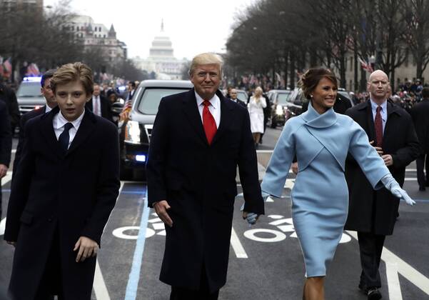 President Donald Trump walks with first lady Melania Trump and their son Barron, left, during the inauguration parade on Pennsylvania Avenue in Washington, DC on January 20, 2017. Trump became the 45th President of the United States. Pool photo by Evan Vucci WAX201701202113 EVANxVUCCI