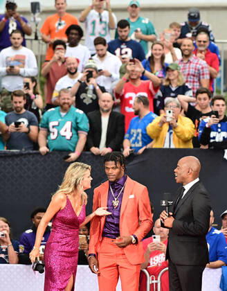 Baltimore Ravens quarterback Lamar Jackson talks with Melissa Stark and Kevin Frasier about the NFL Honors program during Super Bowl LIV week in Miami on Saturday, February 1, 2020.  SBP2020201916 DAVIDxTULIS