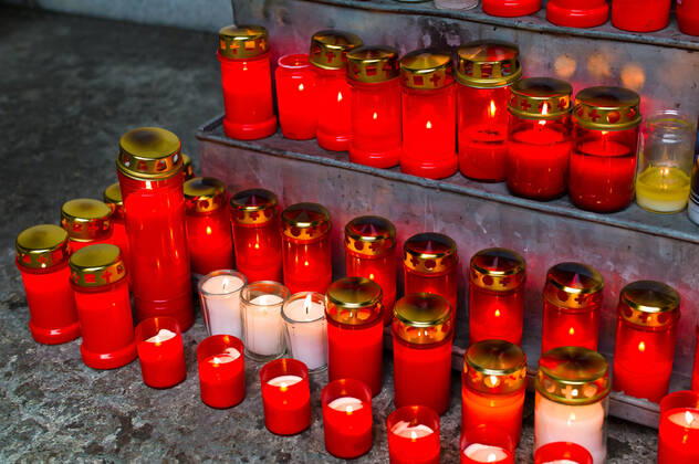 Many grave lights on All Saints Day shine in a cemetery McPBBO McPBBO