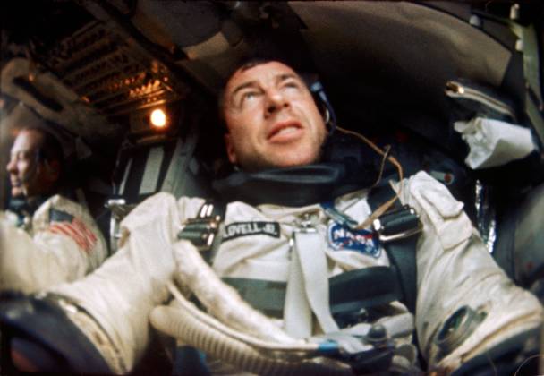 S66-63540 (12 Nov. 1966) --- Astronaut James A. Lovell is photographed inside his Gemini spacecraft during the Gemini-12 mission. Astronaut Edwin Aldrin is seen in the background and to the left. Copyright: xpiemagsx piemagsspace-53348 !ACHTUNG AUFNAHMEDATUM GESCHÄTZT!