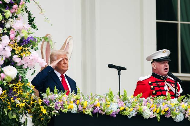 President Donald Trump salutes during the singing of the National Anthem at the 2025 Easter Egg Roll on the South Lawn of the White House in Washington DC on Monday, April 21, 2025 WAX20250421449 SamuelxCorum