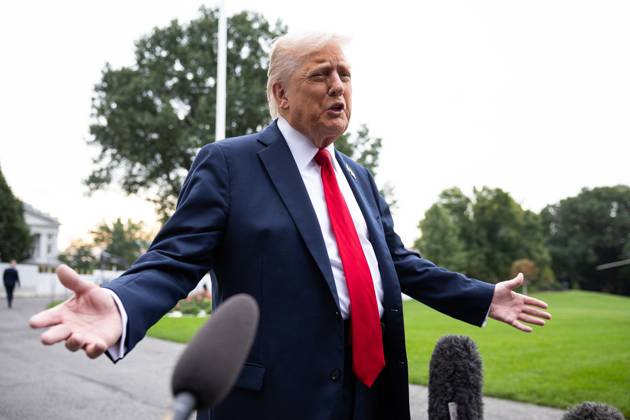 President Donald Trump speaks with reporters as he walks on the South Lawn of the White House on his way to board Marine One on Tuesday, September 30, 2025. He is on his way to Quantico to meet with military officers.  WASP2025093005 FrancisxChung