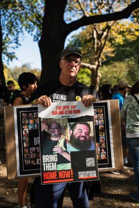 October 5, 2025, New York, New York, USA: A demonstrator holds a sign as hundreds rally in Central Park in support of a deal to end the war in Gaza and free the remaining Israeli hostages in a rally that marks two years since the war began. The negotiating teams are set to start finalizing the details of a ceasefire on Monday according to US President Donald Trumpâ€⠢s peace plan. New York USA - ZUMAg280 20251005_znp_g280_001 Copyright: xYoavxGinsburgx