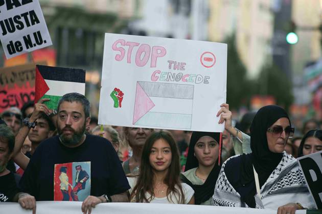 October 4, 2025, Madrid, Madrid, Spain: Protesters hold banners and Palestinian banners during a demonstration in solidarity with the Palestinians in the Gaza strip, in Madrid. Madrid Spain - ZUMA- Oc 20251004_zsp_d308_018 Copyright: xJuanxCarlosxLucasx