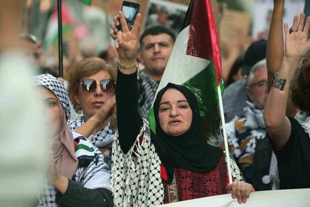 October 4, 2025, Madrid, Madrid, Spain: Protesters hold banners and Palestinian banners during a demonstration in solidarity with the Palestinians in the Gaza strip, in Madrid. Madrid Spain - ZUMA- Oc 20251004_zsp_d308_017 Copyright: xJuanxCarlosxLucasx