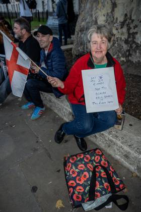 October 6, 2025, London, United Kingdom: A protester holds a placard during the demonstration. A couple of hundred people gathered outside Downing Street to protest against Keir Starmer™s proposal to introduce digital ID into the UK. The demonstration was arranged by Turning Point the organisation originally set up by murdered American far-right activist Charlie Kirk. London United Kingdom - ZUMAs197 20251006_aaa_s197_232 Copyright: xLabxKyxMox