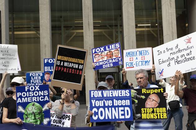October 7, 2025, New York, New York, USA: Demonstrators denouncing Fox News as extremist right-wing propaganda in support of President Trump s administration hold signs that read FOX POISONS AMERICA with an image of owner R. Murdoch with green skin, crossbones, worms and flies on his face MISINFORMATION IS A WEAPON OF OPPRESSION FOX VIEWERS You ve been CONNED Rupert STOP YOUR MONSTER FOX LIES DEMOCRACY DIES with images of Fox anchors J. Watters, S. Hannity, L. Ingraham and G. Gutfeld crossed out FOX MORE EPSTEIN INVESTIGATION LESS MAGA PROPAGANDA AMERICAN NEEDS A FOX-ECTOMY In a time of misinformation Education is an act of Resistance outside of News Corp s Fox News Channel in midtown Manhattan. Protesters with the activist - ZUMAr174 20251007_znp_r174_028 Copyright: xGinaxMxRandazzox