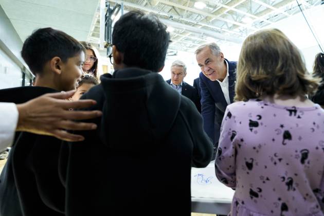 October 10, 2025, Ottawa, On, CAN: Prime Minister Mark Carney speaks with children making art at a community centre before participating in an announcement in Ottawa, on Friday, Oct. 10, 2025. Ottawa CAN - ZUMAc35_ 20251010_zaf_c35_007 Copyright: xJustinxTangx