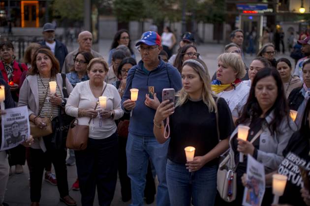 October 11, 2025, Madrid, Madrid, Spain: Members of the Venezuelan community in Madrid holding candles and Venezuelan flags in Opera Square in downtown Madrid, during a vigil to pray the rosary for the beatification of Venezuelans Jose Gregorio Hernandez and Carmen Rendiles on October 19, 2027, in St. Peter s Square, Rome. Madrid Spain - ZUMAs296 20251011_znp_s296_004 Copyright: xLuisxSotox