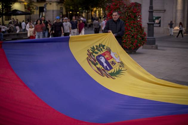 October 11, 2025, Madrid, Madrid, Spain: Members of the Venezuelan community in Madrid holding candles and Venezuelan flags in Opera Square in downtown Madrid, during a vigil to pray the rosary for the beatification of Venezuelans Jose Gregorio Hernandez and Carmen Rendiles on October 19, 2027, in St. Peter s Square, Rome. Madrid Spain - ZUMAs296 20251011_znp_s296_014 Copyright: xLuisxSotox