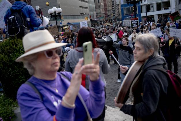October 18, 2025, New York, New York, USA: Protesters march down Broadway during the Ã¢â‚¬oeNo KingsÃ¢â‚¬Â rally in New York, Saturday, Oct. 18, 2025. The demonstration began in Times Square and ended in Union Square, drawing an estimated 50,000 people who joined others across the country calling for the protection of democratic institutions and denouncing authoritarian leadership. Organizers said more than 5 million people participated in over 2,000 marches nationwide. New York USA - ZUMAa306 20251018_znp_a306_002 Copyright: xJavierxAlvarezx