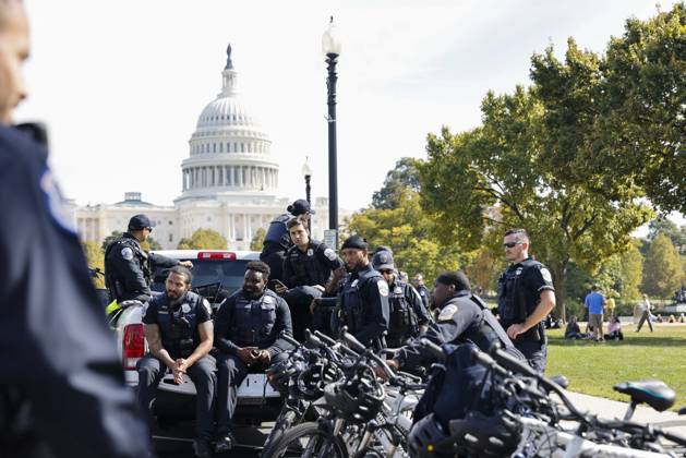 October 18, 2025, Washington Dc, Washington Dc, USA: United States Capitol Police officers are seen while demonstrators take part in a protest against the Donald Trump administration during the No Kings national rally on October 18, 2025, in Washington, DC, USA. Millions of people across the nation joined the No Kings protest to demonstrate their disapproval of the current US administration. The No Kings Day of Defiance has been organized to reject authoritarianism, billionaire-first politics, and the militarization of the countryÃ¢â‚¬â ¢s democracy, according to a statement by organizers. Washington Dc USA - ZUMAk203 20251018_znp_k203_033 Copyright: xAashishxKiphayetx
