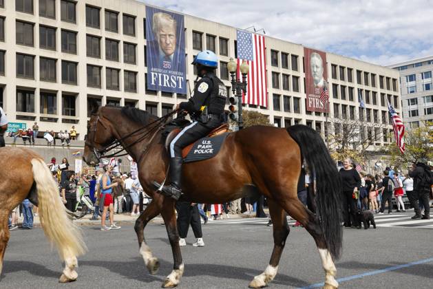 October 18, 2025, Washington Dc, Washington Dc, USA: United States Park Police members are seen while demonstrators take part in a protest against the Donald Trump administration during the No Kings national rally on October 18, 2025, in Washington, DC, USA. Millions of people across the nation joined the No Kings protest to demonstrate their disapproval of the current US administration. The No Kings Day of Defiance has been organized to reject authoritarianism, billionaire-first politics, and the militarization of the countryÃ¢â‚¬â ¢s democracy, according to a statement by organizers. Washington Dc USA - ZUMAk203 20251018_znp_k203_037 Copyright: xAashishxKiphayetx