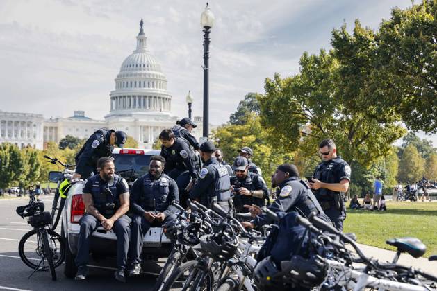 October 18, 2025, Washington Dc, Washington Dc, USA: United States Capitol Police officers are seen while demonstrators take part in a protest against the Donald Trump administration during the No Kings national rally on October 18, 2025, in Washington, DC, USA. Millions of people across the nation joined the No Kings protest to demonstrate their disapproval of the current US administration. The No Kings Day of Defiance has been organized to reject authoritarianism, billionaire-first politics, and the militarization of the countryÃ¢â‚¬â ¢s democracy, according to a statement by organizers. Washington Dc USA - ZUMAk203 20251018_znp_k203_032 Copyright: xAashishxKiphayetx