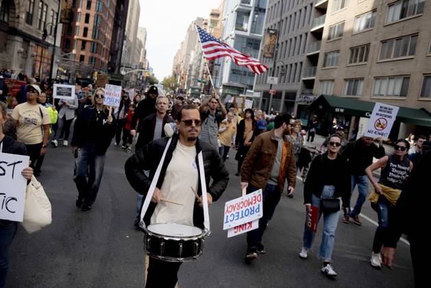 October 18, 2025, New York, New York, USA: Protesters march down Broadway during the Ã¢â‚¬oeNo KingsÃ¢â‚¬Â rally in New York, Saturday, Oct. 18, 2025. The demonstration began in Times Square and ended in Union Square, drawing an estimated 50,000 people who joined others across the country calling for the protection of democratic institutions and denouncing authoritarian leadership. Organizers said more than 5 million people participated in over 2,000 marches nationwide. New York USA - ZUMAa306 20251018_znp_a306_001 Copyright: xJavierxAlvarezx