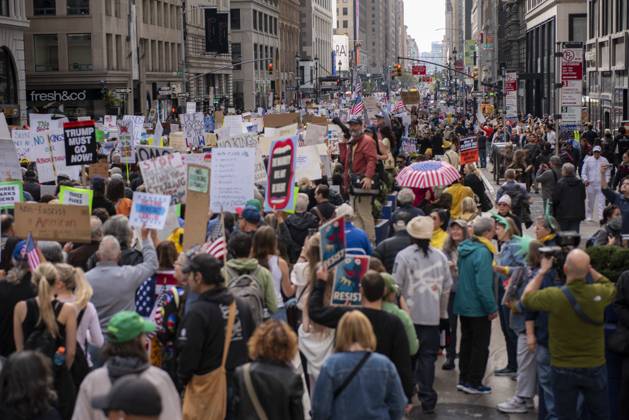 October 18, 2025, New York, New York, USA: Protesters march down Broadway during the Ã¢â‚¬oeNo KingsÃ¢â‚¬Â rally in New York, Saturday, Oct. 18, 2025. The demonstration began in Times Square and ended in Union Square, drawing an estimated 50,000 people who joined others across the country calling for the protection of democratic institutions and denouncing authoritarian leadership. Organizers said more than 5 million people participated in over 2,000 marches nationwide. New York USA - ZUMAa306 20251018_znp_a306_006 Copyright: xJavierxAlvarezx
