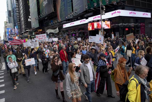 October 18, 2025, New York, New York, USA: Protesters march down Broadway during the Ã¢â‚¬oeNo KingsÃ¢â‚¬Â rally in New York, Saturday, Oct. 18, 2025. The demonstration began in Times Square and ended in Union Square, drawing an estimated 50,000 people who joined others across the country calling for the protection of democratic institutions and denouncing authoritarian leadership. Organizers said more than 5 million people participated in over 2,000 marches nationwide. New York USA - ZUMAa306 20251018_znp_a306_011 Copyright: xJavierxAlvarezx