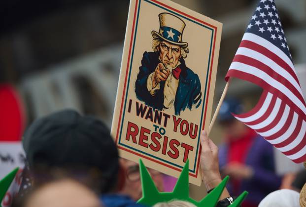 October 18, 2025, New York, New York, USA: Protester holds sign of Uncle Sam that reads, Ã¢â‚¬oeI want you to resistÃ¢â‚¬Â in the New York City No Kings protest in opposition to measures Donald Trump has taken to install authoritarian style rule. New York USA - ZUMAl171 20251018_znp_l171_036 Copyright: xEdnaxLeshowitzx