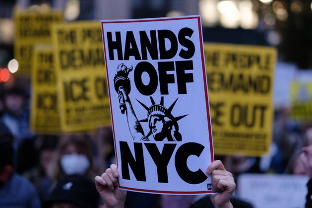 October 22, 2025, New York, New York, USA: A protester holds a sign saying Ã¢â‚¬oeHANDS OFF NYCÃ¢â‚¬Â during an anti-ICE demonstration at Foley Square, in New York, on Wednesday, Oct. 22, 2025. This response comes after more than 50 federal agents arrested immigrant vendors at Canal Street, lower Manhattan, on Tuesday. New York USA - ZUMAs368 20251022_zip_s368_004 Copyright: xMarcoxPostigoxStorelx
