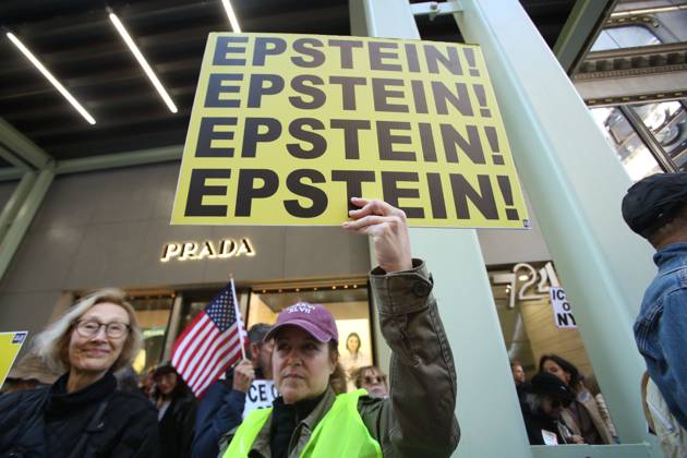 October 25, 2025, New York City, New York, USA: A woman holds a sign that says Epstein during a Hands Off NYC rally. outside of Trump Tower on October 25, 2025. Some women wore polka dots in honor of a protestor who confronted ICE agents and tank vehicles. The peaceful rally drew a handful of Trump supporters. New York City USA - ZUMAk45_ 20251025_zaf_k45_011 Copyright: xKristaxKennellx