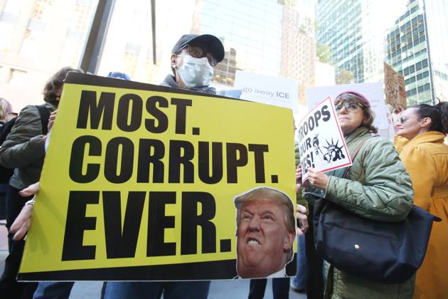 October 25, 2025, New York City, New York, USA: A woman holds a sign that says Most Corrupt Ever during a Hands Off NYC rally outside of Trump Tower on October 25, 2025. Some women wore polka dots in honor of a protestor who confronted ICE agents and tank vehicles. The peaceful rally drew a handful of Trump supporters. New York City USA - ZUMAk45_ 20251025_zaf_k45_022 Copyright: xKristaxKennellx