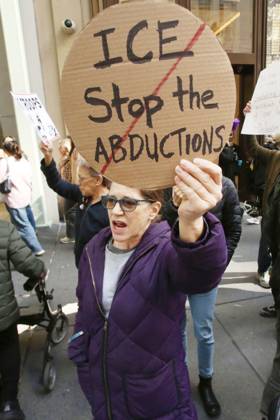October 25, 2025, New York City, New York, USA: A woman holds a sign that says ICE, Stop the Abductions during a Hands Off NYC rally outside of Trump Tower on October 25, 2025. Some women wore polka dots in honor of a protestor who confronted ICE agents and tank vehicles. The peaceful rally drew a handful of Trump supporters. New York City USA - ZUMAk45_ 20251025_zaf_k45_035 Copyright: xKristaxKennellx