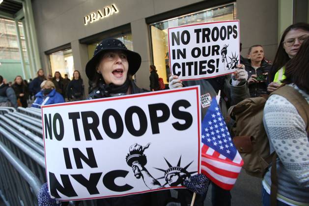 October 25, 2025, New York City, New York, USA: A woman holds a sign during a Hands Off NYC rally outside of Trump Tower on October 25, 2025. Some women wore polka dots in honor of a protestor who confronted ICE agents and tank vehicles. The peaceful rally drew a handful of Trump supporters. New York City USA - ZUMAk45_ 20251025_zaf_k45_038 Copyright: xKristaxKennellx