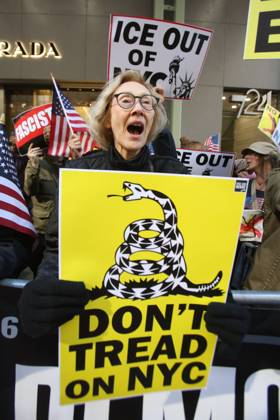 October 25, 2025, New York City, New York, USA: A woman holds a sign that says Don t Tread on NYC during a Hands Off NYC rally outside of Trump Tower. Some women wore polka dots in honor of a protestor who confronted ICE agents and tank vehicles. The peaceful rally drew a handful of Trump supporters. New York City USA - ZUMAk45_ 20251025_zaf_k45_016 Copyright: xKristaxKennellx