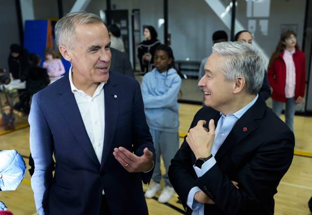 October 10, 2025, Ottawa, On, CAN: Prime Minister Mark Carney jokes with Minister of Finance and National Revenue Francois-Philippe Champagne as they greet families before participating in an announcement at a community centre in Ottawa, on Friday, Oct. 10, 2025. Ottawa CAN - ZUMAc35_ 20251010_zaf_c35_162 Copyright: xJustinxTangx