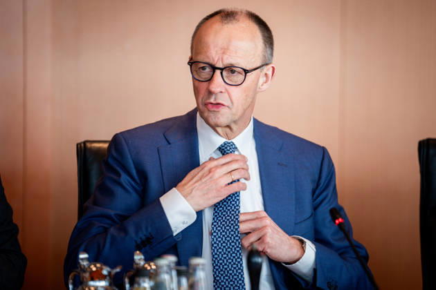 Federal Cabinet meeting, 18 03 2026, Berlin, Federal Chancellor Friedrich Merz CDU adjusts his tie in the run-up to the cabinet meeting, Federal Cabinet meeting at the Federal Chancellery in Berlin Berlin Berlin Germany