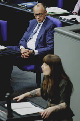 L R Friedrich Merz CDU , Federal Chancellor, and Heidi Reichinnek, Member of the German Bundestag Die Linke , taken during the debate on the government declaration in the German Bundestag in Berlin, 18 03 2026 Berlin Germany Copyright: xFlorianxGaertnerx