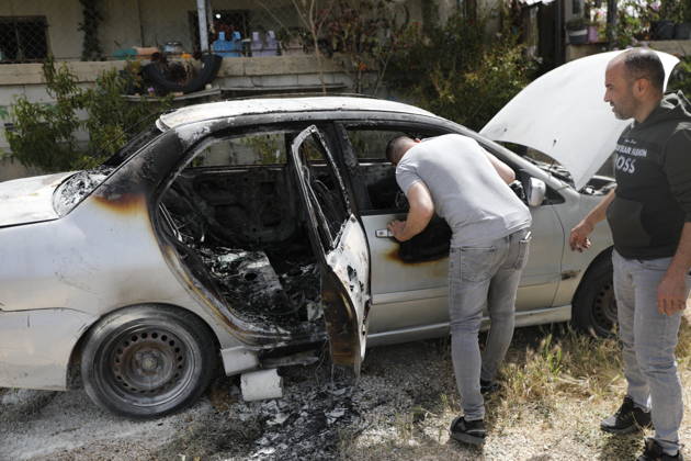 Palestinians inspect damage after settler attack near Hebron Palestinians inspect damage at the site of an attack carried out by Israeli settlers targeting Palestinian vehicles and property in the town of Surif northwest of Hebron in the occupied West Bank on May 17, 2026. Settlers set fire to a vehicle and spray-painted racist slogans at the scene, amid anger and condemnation among Palestinian residents over repeated attacks on their property. Photo by Mamoun Wazwaz apaimages Hebron West Bank Palestinian Territory 170526_Hebron_MW_00(16) Copyright: xapaimagesxMamounxWazwazx xapaimagesx