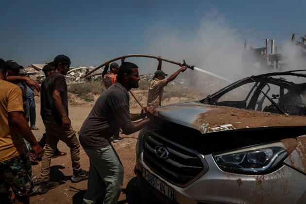 Israeli attacks continue in Gaza GAZA, PALESTINE - JULY 21 : Firefighters and local Palestinians attempt to extinguish a burning civilian vehicle after it was targeted in an Israeli attack in the Nuseirat refugee camp in the central Gaza Strip on July 21, 2026 in Gaza, Palestine. Abdalhkem Abu Riash Anadolu Gaza City Gaza. Editorial use only. Please get in touch for any other usage.  Copyright: x2026xAnadoluxAbdalhkemxAbuxRiashx