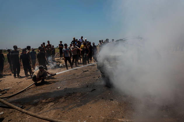 Israeli attacks continue in Gaza GAZA, PALESTINE - JULY 21 : Firefighters and local Palestinians attempt to extinguish a burning civilian vehicle after it was targeted in an Israeli attack in the Nuseirat refugee camp in the central Gaza Strip on July 21, 2026 in Gaza, Palestine. Abdalhkem Abu Riash Anadolu Gaza City Gaza. Editorial use only. Please get in touch for any other usage.  Copyright: x2026xAnadoluxAbdalhkemxAbuxRiashx