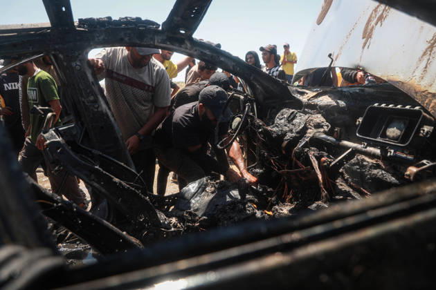 Israeli attacks continue in Gaza GAZA, PALESTINE - JULY 21 : Firefighters and local Palestinians attempt to extinguish a burning civilian vehicle after it was targeted in an Israeli attack in the Nuseirat refugee camp in the central Gaza Strip on July 21, 2026 in Gaza, Palestine. Abdalhkem Abu Riash Anadolu Gaza City Gaza. Editorial use only. Please get in touch for any other usage.  Copyright: x2026xAnadoluxAbdalhkemxAbuxRiashx