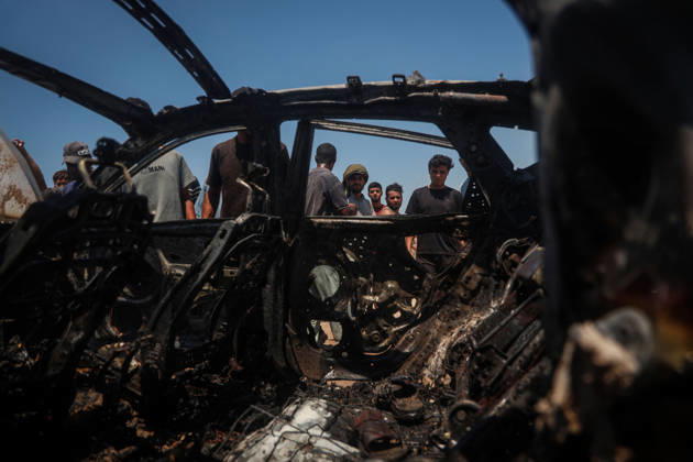 Israeli attacks continue in Gaza GAZA, PALESTINE - JULY 21 : Firefighters and local Palestinians attempt to extinguish a burning civilian vehicle after it was targeted in an Israeli attack in the Nuseirat refugee camp in the central Gaza Strip on July 21, 2026 in Gaza, Palestine. Abdalhkem Abu Riash Anadolu Gaza City Gaza. Editorial use only. Please get in touch for any other usage.  Copyright: x2026xAnadoluxAbdalhkemxAbuxRiashx