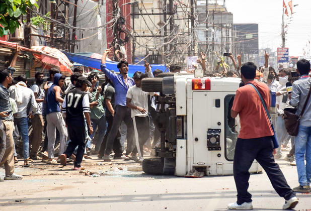 Clashes erupt between police and protesters during the Bihar Bandh protest Patna, Jul 25 (ANI): Protesters damage a police vehicle during the Bihar Bandh protest against the alleged NEET paper leak, in Patna on Saturday. PATNA BIHAR INDIA Copyright: xANIx ANI_20260725384