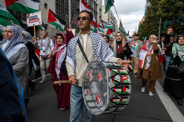 October 3, 2026, Berlin, Germany: BERLIN, GERMANY †OCTOBER 3, 2026: Thousands of people took part in a peace demonstration in central Berlin on German Unity Day. A coalition of peace initiatives, trade unions, and political and civil-society groups organized the protest. The demonstrators focused on military rearmament, the possible reintroduction of conscription, and Germanyâ€⠢s military policy. The march began at the Brandenburg Gate and continued through the government district before concluding with a rally. The demonstration brought together participants expressing opposition to Germanyâ€⠢s current and proposed military policies on a national public holiday. Berlin Germany - ZUMAq101 20261003_zna_q101_089 Copyright: xJessxFlomx