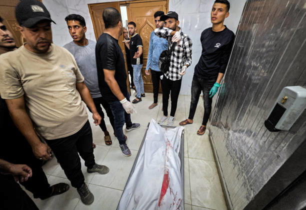 Body of Palestinian Killed in Khan Younis Strike Taken to Nasser Medical Complex Palestinians carry the body of 36-year-old Moaz Jamal Abu Nusaira to Nasser Medical Complex on October 4, 2026, after he was killed in an Israeli airstrike that targeted him north of Khan Younis, in the southern Gaza Strip. Photo by Tariq Mohammad APA Images Khan Yunis Gaza Strip Palestinian Territory 041026_Khan_Yunis_TM_00(1) Copyright: xapaimagesxTariqxMohammad xapaimagesx
