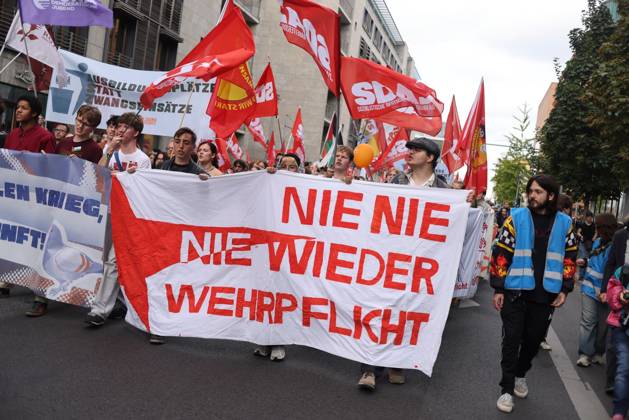 October 3, 2026, Berlin, Berlin, Germany: BERLIN, GERMANY, OCTOBER 3, 2026: Thousands of demonstrators march through central Berlin during a protest against Germany s military buildup, increased defense spending and the possible reintroduction of compulsory military service. Protesters called for greater investment in healthcare, housing, education and other social services instead of military spending, while participants also demonstrated against German arms deliveries and support for Israel amid the war in Gaza. The march began at the Brandenburg Gate and continued through central Berlin before returning to the area. Berlin Germany - ZUMAq101 20261003_zna_q101_214 Copyright: xZairaxBiaginix