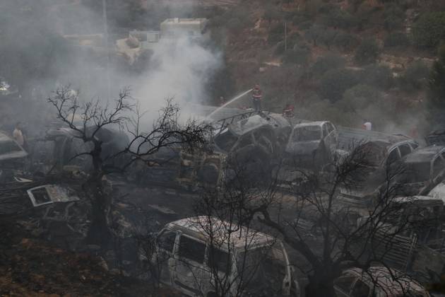 Israeli Settlers Set Fire To Olive Trees And Car Scrap Yard Near Silwad SILWAD, WEST BANK, PALESTINE OCTOBER 4, 2026: Israeli settlers set fire to olive trees and a car scrap yard between the villages of Ein Yabrud and Silwad, according to the information provided. The owner of the repair shop said more than 50 cars were destroyed in the fire. The incident occurred amid ongoing attacks targeting Palestinian property and agricultural land in the area. Fires affecting olive trees and other Palestinian property have also been reported in areas around Silwad. Ramallah Palestine, State of Copyright: x xSalmanxMohsenxAlkhatibx xJNAxPressx