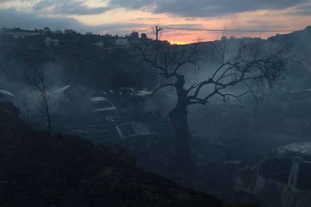 Israeli Settlers Set Fire To Olive Trees And Car Scrap Yard Near Silwad SILWAD, WEST BANK, PALESTINE OCTOBER 4, 2026: Israeli settlers set fire to olive trees and a car scrap yard between the villages of Ein Yabrud and Silwad, according to the information provided. The owner of the repair shop said more than 50 cars were destroyed in the fire. The incident occurred amid ongoing attacks targeting Palestinian property and agricultural land in the area. Fires affecting olive trees and other Palestinian property have also been reported in areas around Silwad. Ramallah Palestine, State of Copyright: x xSalmanxMohsenxAlkhatibx xJNAxPressx