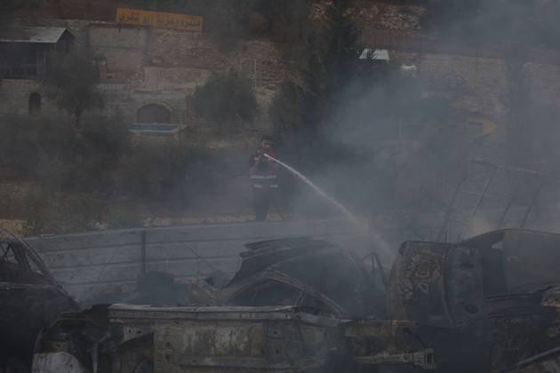 Israeli Settlers Set Fire To Olive Trees And Car Scrap Yard Near Silwad SILWAD, WEST BANK, PALESTINE OCTOBER 4, 2026: Israeli settlers set fire to olive trees and a car scrap yard between the villages of Ein Yabrud and Silwad, according to the information provided. The owner of the repair shop said more than 50 cars were destroyed in the fire. The incident occurred amid ongoing attacks targeting Palestinian property and agricultural land in the area. Fires affecting olive trees and other Palestinian property have also been reported in areas around Silwad. Ramallah Palestine, State of Copyright: x xSalmanxMohsenxAlkhatibx xJNAxPressx