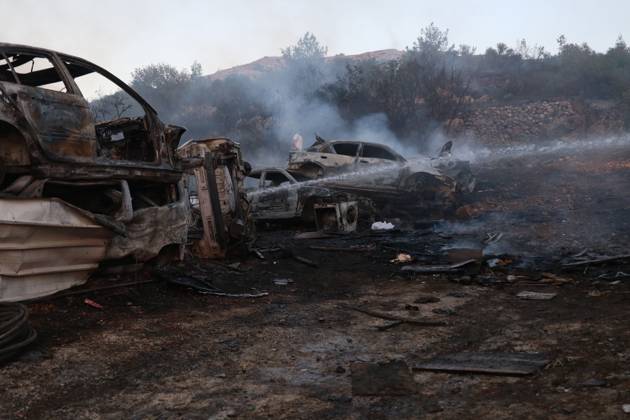 Israeli Settlers Set Fire To Olive Trees And Car Scrap Yard Near Silwad SILWAD, WEST BANK, PALESTINE OCTOBER 4, 2026: Israeli settlers set fire to olive trees and a car scrap yard between the villages of Ein Yabrud and Silwad, according to the information provided. The owner of the repair shop said more than 50 cars were destroyed in the fire. The incident occurred amid ongoing attacks targeting Palestinian property and agricultural land in the area. Fires affecting olive trees and other Palestinian property have also been reported in areas around Silwad. Ramallah Palestine, State of Copyright: x xSalmanxMohsenxAlkhatibx xJNAxPressx