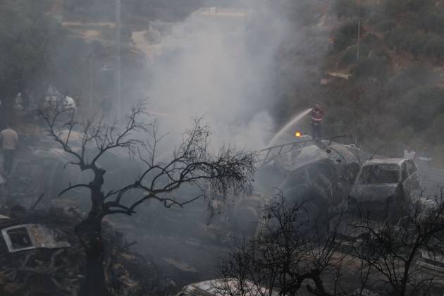 Israeli Settlers Set Fire To Olive Trees And Car Scrap Yard Near Silwad SILWAD, WEST BANK, PALESTINE OCTOBER 4, 2026: Israeli settlers set fire to olive trees and a car scrap yard between the villages of Ein Yabrud and Silwad, according to the information provided. The owner of the repair shop said more than 50 cars were destroyed in the fire. The incident occurred amid ongoing attacks targeting Palestinian property and agricultural land in the area. Fires affecting olive trees and other Palestinian property have also been reported in areas around Silwad. Ramallah Palestine, State of Copyright: x xSalmanxMohsenxAlkhatibx xJNAxPressx