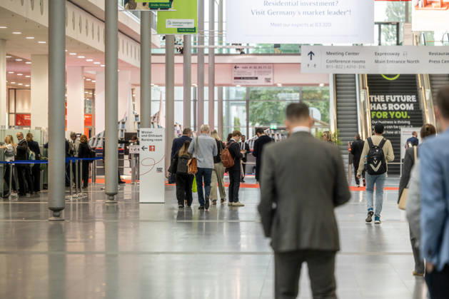 EXPO REAL 2026 in Munich, October 5, 2026: Trade visitors on their way to the exhibition halls at the Messe München grounds. First day of EXPO REAL 2026, the international trade fair for real estate, investments, and infrastructure will take place from October 5 to 7, 2026, in Munich, bringing t