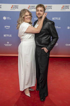 ABB FIRSTSTEPS: Gisa Flake and Knud Riepen walk the red carpet at the 2026 FIRST STEPS Awards ceremony at the Theater des Westens on October 5, 2026, in Berlin, Germany