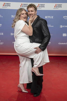 ABB FIRSTSTEPS: Gisa Flake and Knud Riepen walk the red carpet at the 2026 FIRST STEPS Awards ceremony at the Theater des Westens on October 5, 2026, in Berlin, Germany